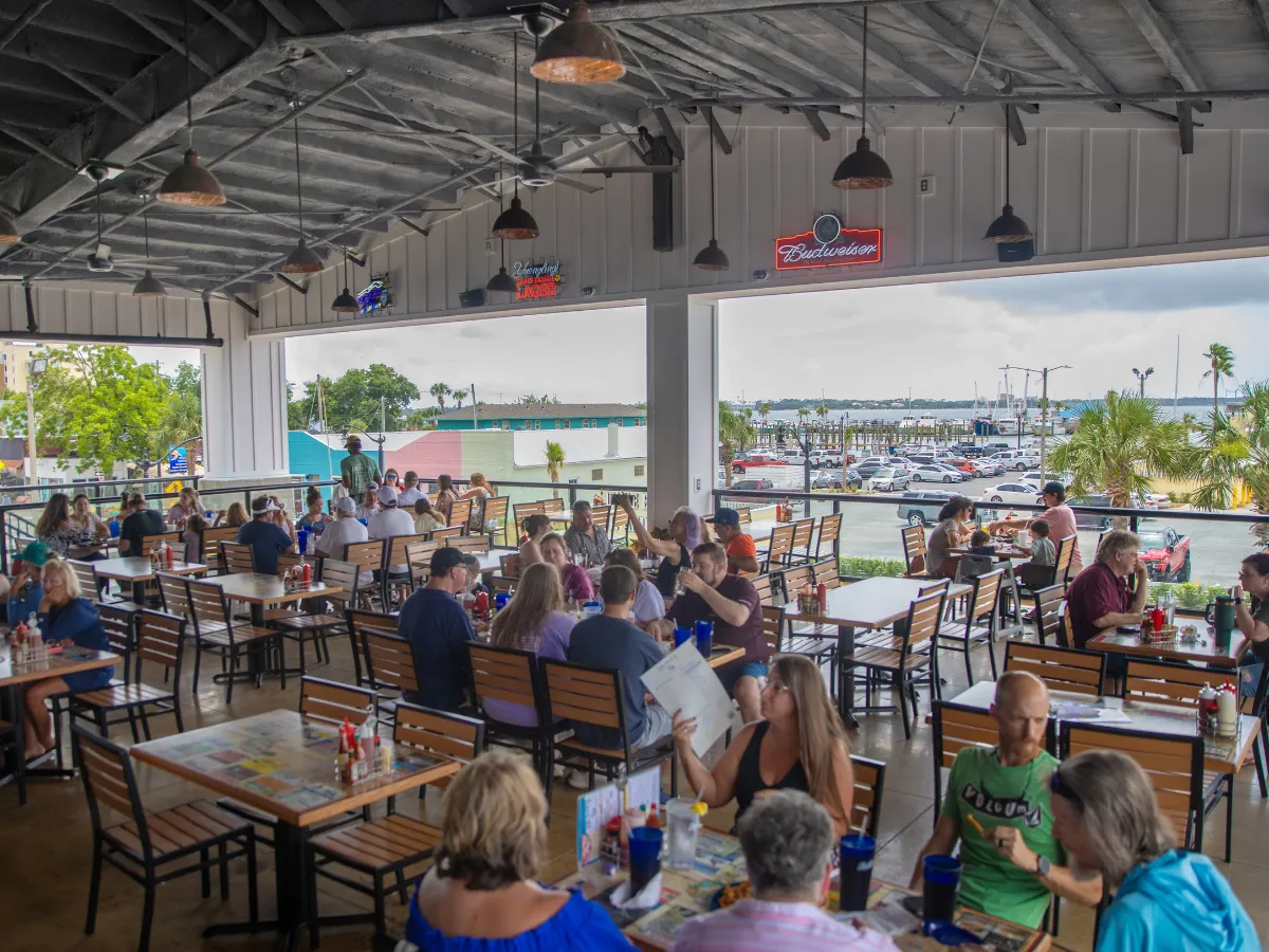 Hunt's Oyster Bar in Panama City, Florida dining room with waterfront views overlooking Historic St. Andrews.