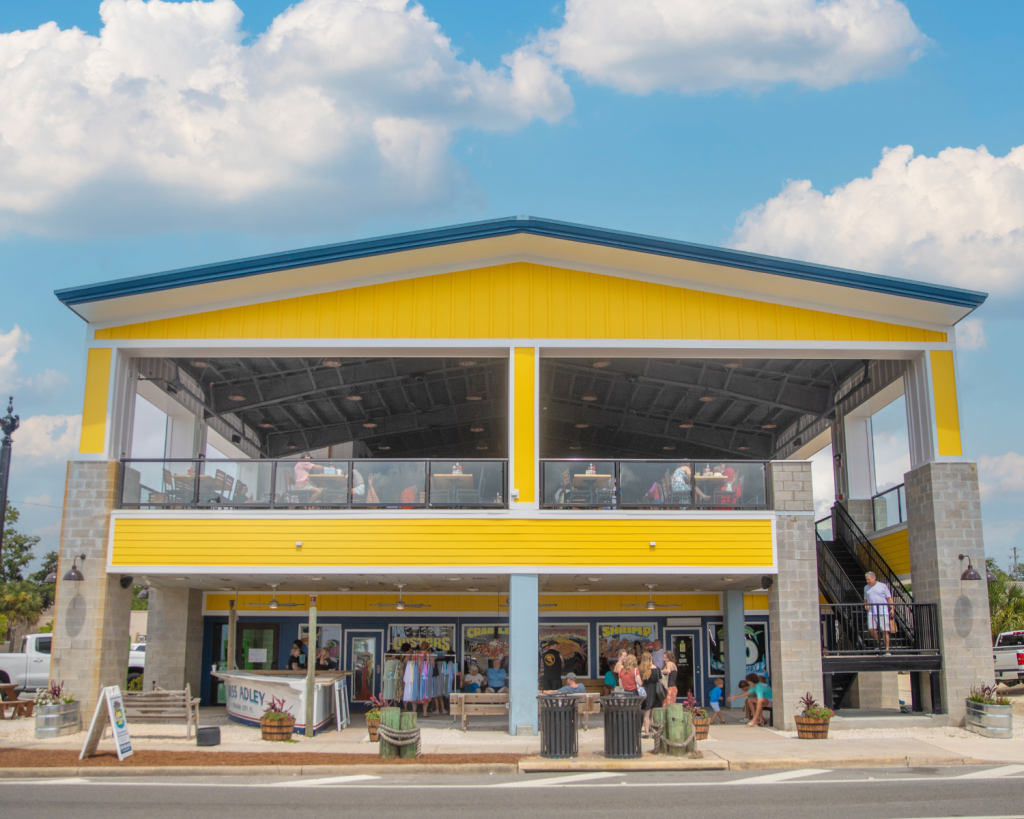 National Oyster Day Shines Bright with the Golden Oyster at Hunt’s in Panama City: A Truly Unforgettable Celebration 3 The bright yellow exterior of Hunt's Oyster Bar in Panama City, Florida welcomes guests for National Oyster Day festivities.