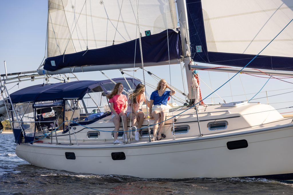 Panama City Sail boat 3 girls laughing on side of sail boat 2024 Orange Video 1