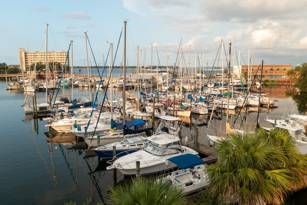 Aerial view of sailboats docked at the marina in Massalina Bayou, a peaceful relaxing spot in Panama City for boating enthusiasts.