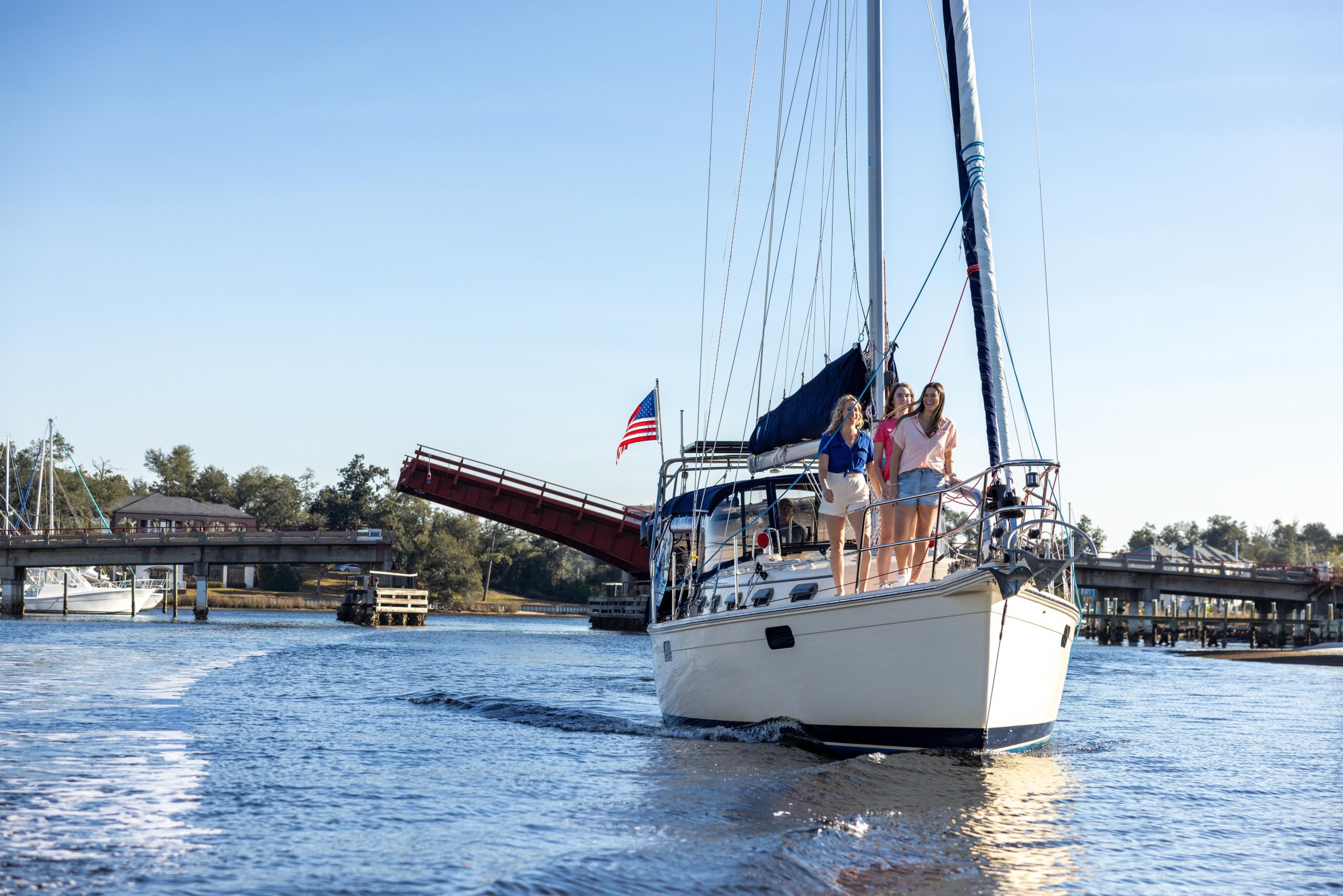 Panama City - Home to World Champions, Historic Marvels, and Rare Natural Wonders in Florida 1 Panama City Sail boat 3 girls smiling at sail boat front 2024 Orange Video 6 scaled