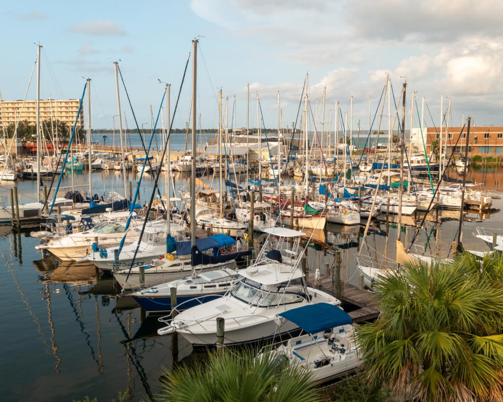 Outdoor & Water Activities in Panama City, Florida 7 Docked sailboats and fishing vessels line the marina, a central hub for water activities in Panama City, Florida.