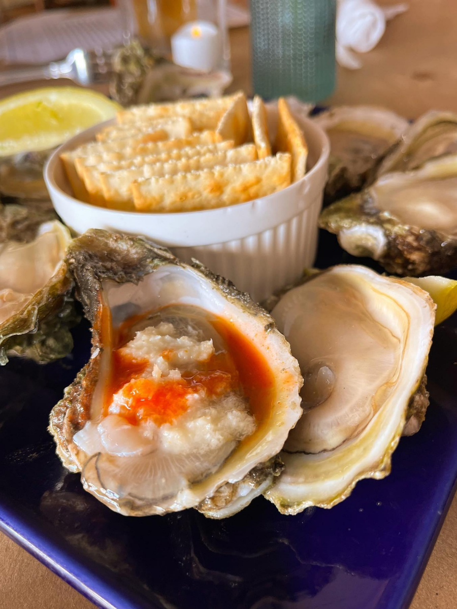 National Oyster Day Shines Bright with the Golden Oyster at Hunt’s Oyster Bar in Panama City, Florida 8 A close-up view of freshly shucked oysters on ice with lemon wedges at Hunt's Oyster Bar in Panama City, Florida for National Oyster Day.