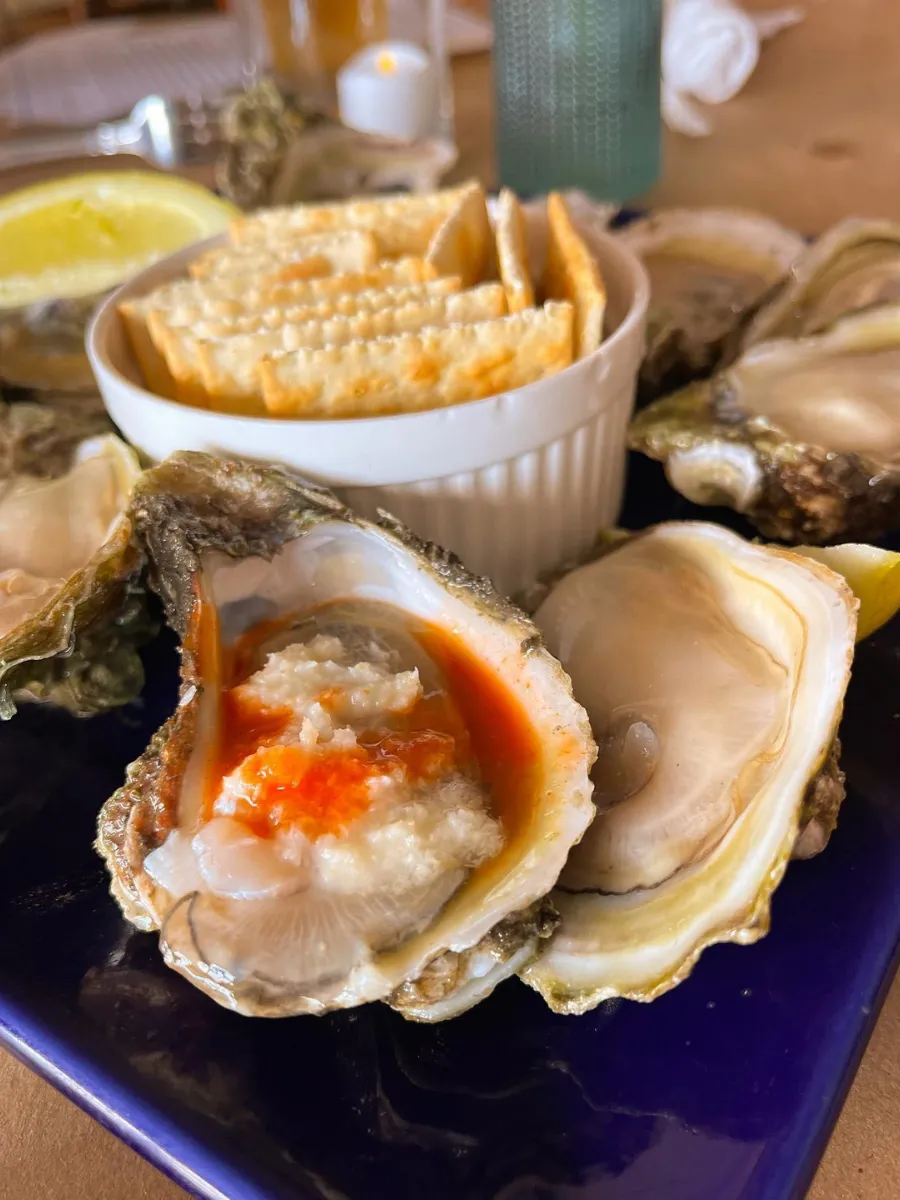 National Oyster Day Shines Bright with the Golden Oyster at Hunt’s Oyster Bar in Panama City, Florida 8 A close-up view of freshly shucked oysters on ice with lemon wedges at Hunt's Oyster Bar in Panama City, Florida for National Oyster Day.