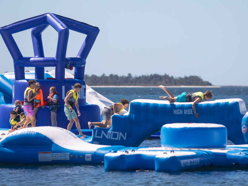 Top 10 Activities for a Family-Friendly Spring Break in Panama City, Florida 18 Kids climbing and playing on an inflatable water obstacle course during a family-friendly spring break in Panama City.