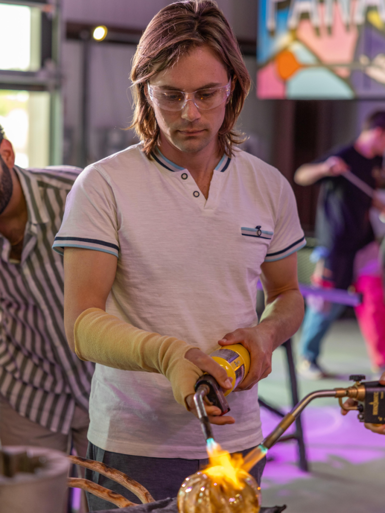 Top 10 Activities for a Family-Friendly Spring Break in Panama City, Florida 6 Glass artist shaping molten glass during a hands-on workshop, a creative activity during a family-friendly spring break in Panama City.