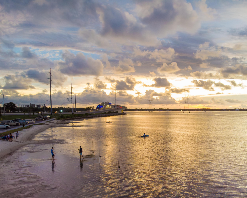 3 Breathtaking Spots for Snorkeling in Panama City, Florida: Where to Go and What to Know 8 Golden sunset over calm bay waters where visitors enjoy coastal views near popular spots for snorkeling in Panama City, Florida.