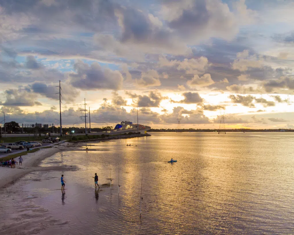 3 Fun Spots for Snorkeling in Panama City, Florida: Where to Go and What to Know 8 Golden sunset over calm bay waters where visitors enjoy coastal views near popular spots for snorkeling in Panama City, Florida.