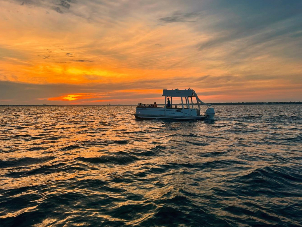 Top Spring Break Outdoor Adventures in Panama City, Florida 13 Spring break outdoor adventures in Panama City featuring a sunset excursion on St. Andrews Bay aboard a double decker pontoon boat with slide.