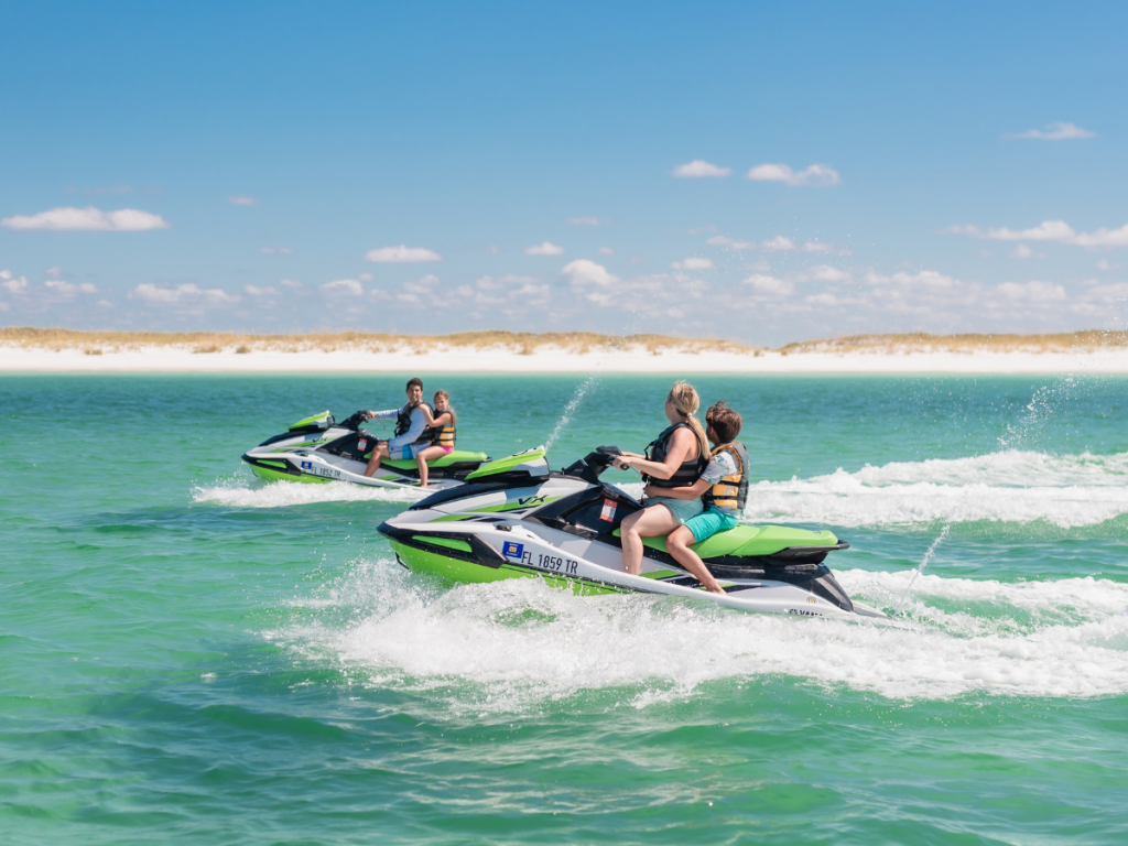 Top Spring Break Outdoor Adventures in Panama City, Florida 14 Spring break outdoor adventures in Panama City featuring riders exploring the waters of St. Andrews Bay on jet skis.