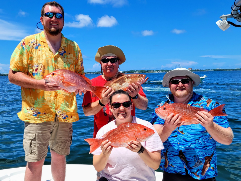 Top Spring Break Outdoor Adventures in Panama City, Florida 17 Spring break outdoor adventures in Panama City featuring a group celebrating a successful fishing charter with fresh Gulf catches on the boat.