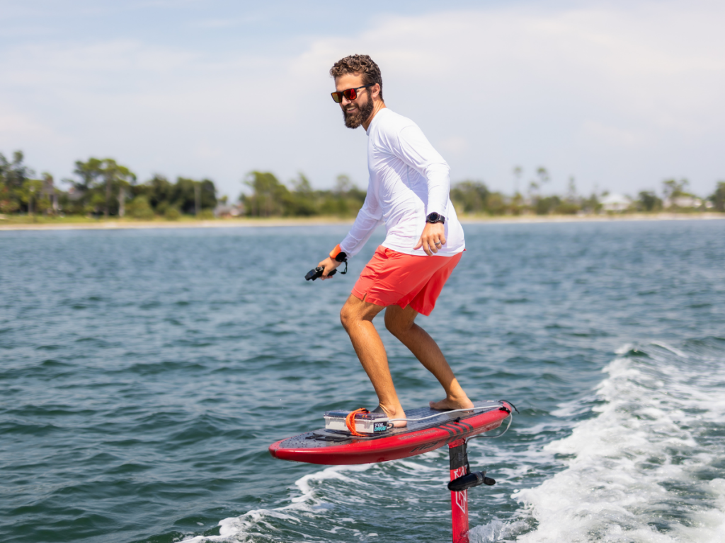 Top Spring Break Outdoor Adventures in Panama City, Florida 6 Spring break outdoor adventures in Panama City featuring a rider gliding across St. Andrews Bay on an electric hydrofoil board.