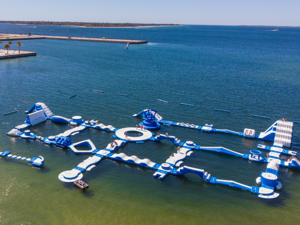 Top Spring Break Outdoor Adventures in Panama City, Florida 9 Spring break outdoor adventures in Panama City featuring an aerial view of the inflatable floating water park in St. Andrews Bay.