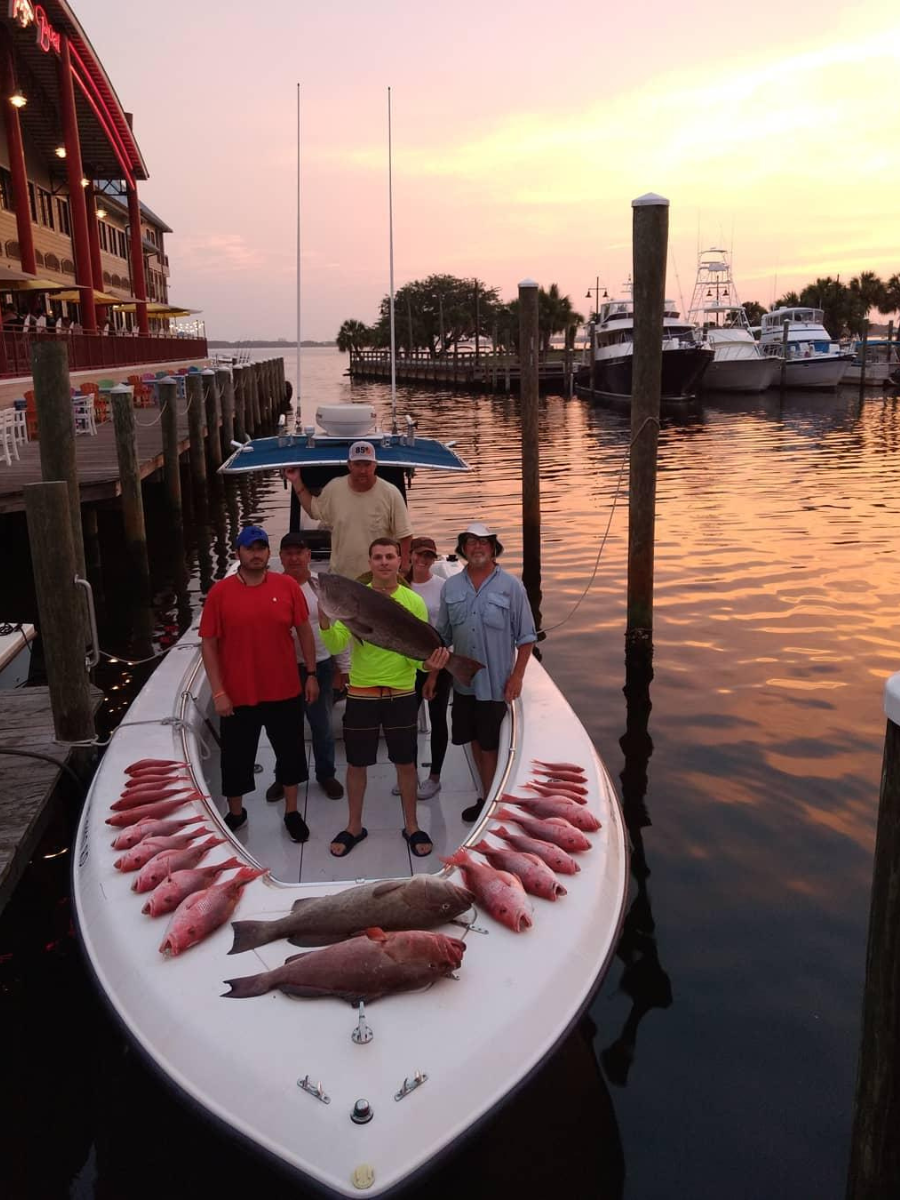 Fishing Seasons in Panama City, Florida: Your Complete Guide to Year-Round Action on the Gulf 3 Fishing charter group with a full catch of red snapper and grouper at the Panama City Marina during peak fishing seasons in Panama City