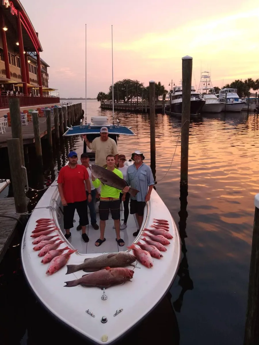 Fishing Seasons in Panama City, Florida: Your Complete Guide to Year-Round Action on the Gulf 3 Fishing charter group with a full catch of red snapper and grouper at the Panama City Marina during peak fishing seasons in Panama City