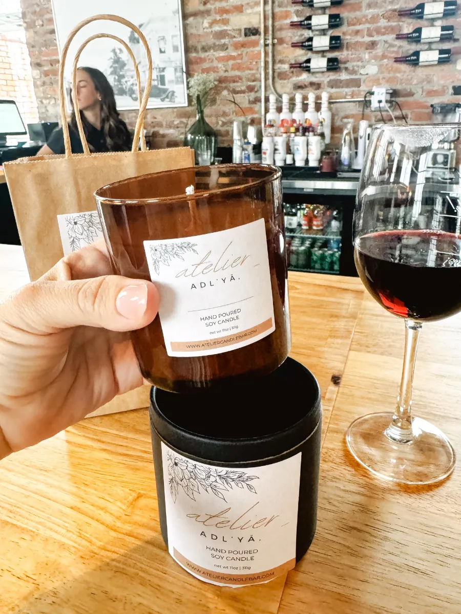 Handmade Atelier soy candle and a glass of wine, the perfect pairing at this hands-on activity in Panama City Florida