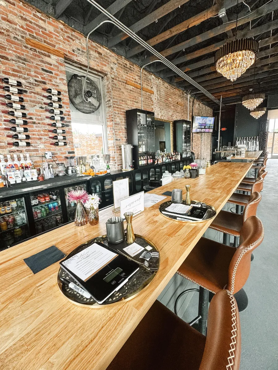 Inside Atelier candle bar and lounge in Panama City FL, where candle making meets craft cocktails for a standout skillcation experience in Florida