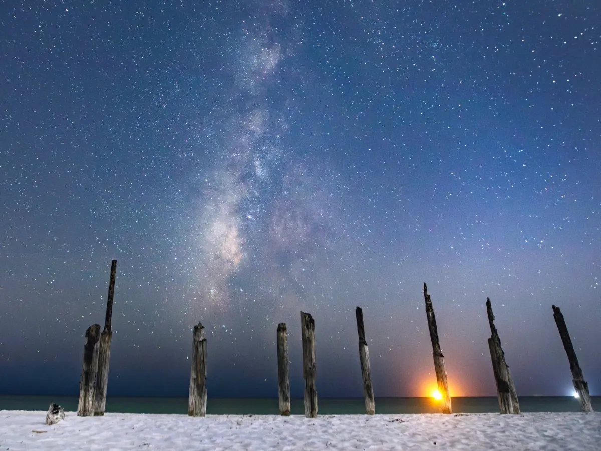 The Milky Way over a Panama City beach, the stunning backdrop for night sky photography classes offered as a skillcation in Florida