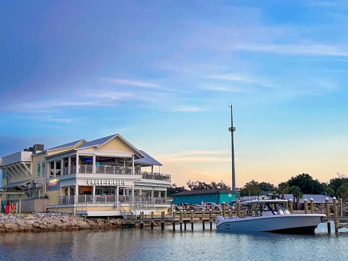 Hook and Cook in Panama City, FL: Where to Bring Your Fresh Catch for Dinner 5 Uncle Ernie's Bayfront Grill at sunset in Historic St. Andrews, one of the top restaurants that cook your fish in Panama City FL