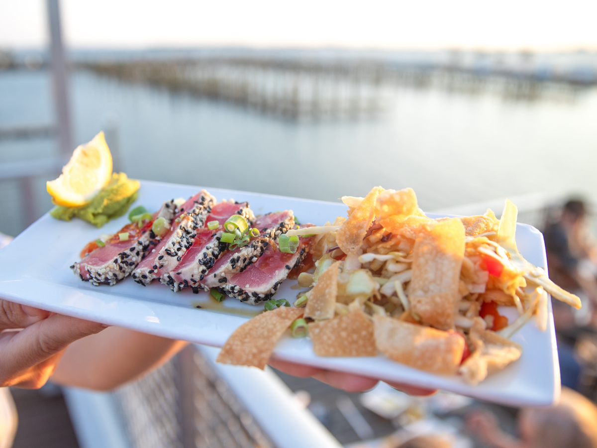 Hook and Cook in Panama City, FL: Where to Bring Your Fresh Catch for Dinner 6 Fresh seared Gulf tuna served waterfront, the kind of meal you get from the restaurants that cook your fish in Panama City FL