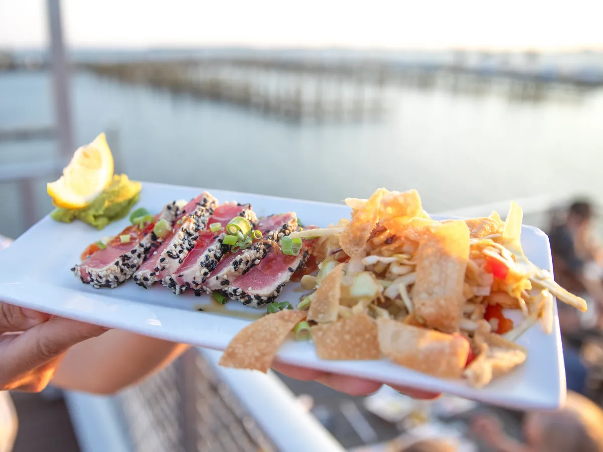 Hook and Cook in Panama City, FL: Where to Bring Your Fresh Catch for Dinner 6 Fresh seared Gulf tuna served waterfront, the kind of meal you get from the restaurants that cook your fish in Panama City FL
