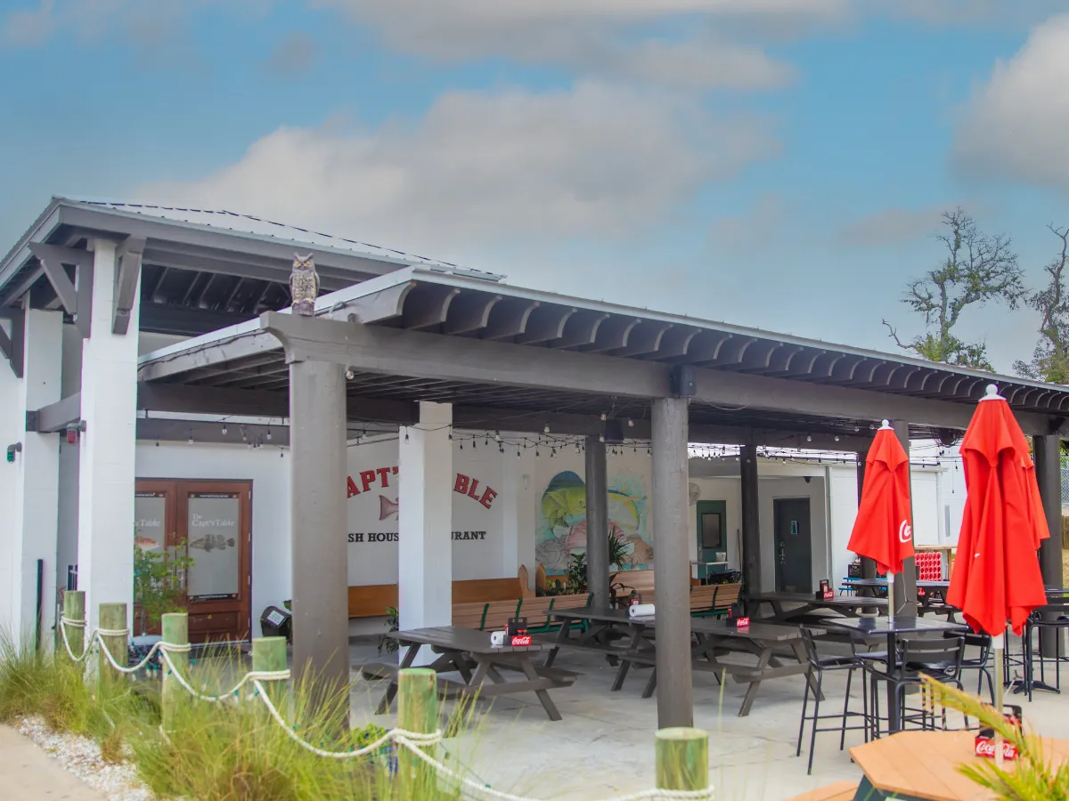 Hook and Cook in Panama City, FL: Where to Bring Your Fresh Catch for Dinner 7 Outdoor patio at Capt's Table Fish House, one of the most popular restaurants that cook your fish in Panama City FL