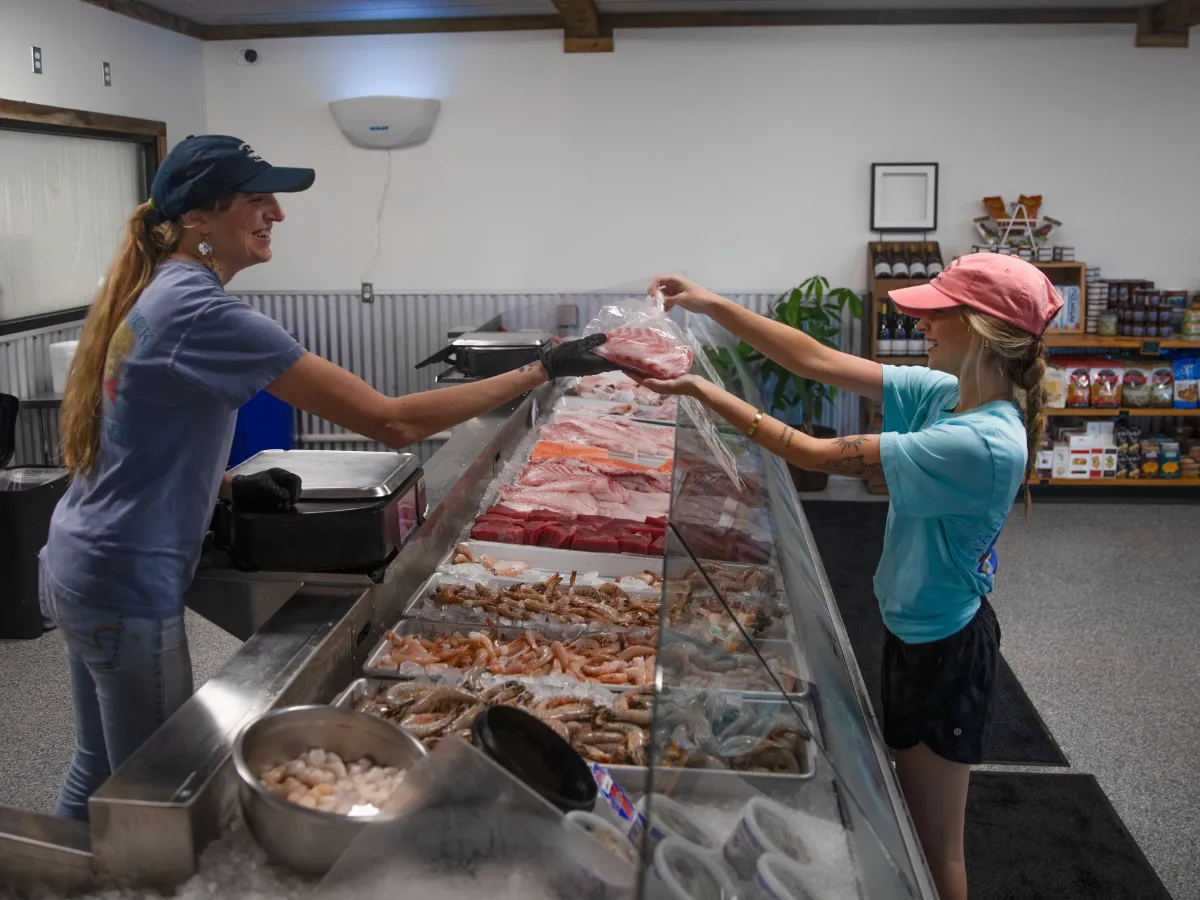 Hook and Cook in Panama City, FL: Where to Bring Your Fresh Catch for Dinner 12 Fresh Gulf seafood counter at a Panama City market, where anglers can bring their catch as part of the hook and cook experience in Panama City FL
