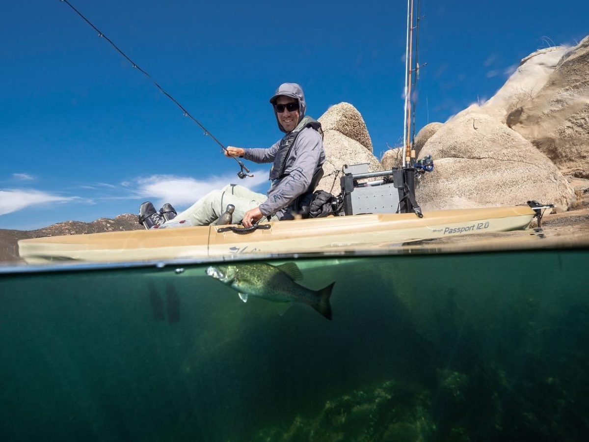 Types of Fishing in Panama City, Florida: Every Way to Get on the Water 13 Angler kayak fishing with a fish visible below the surface, one of the most exciting ways to fish in Panama City FL