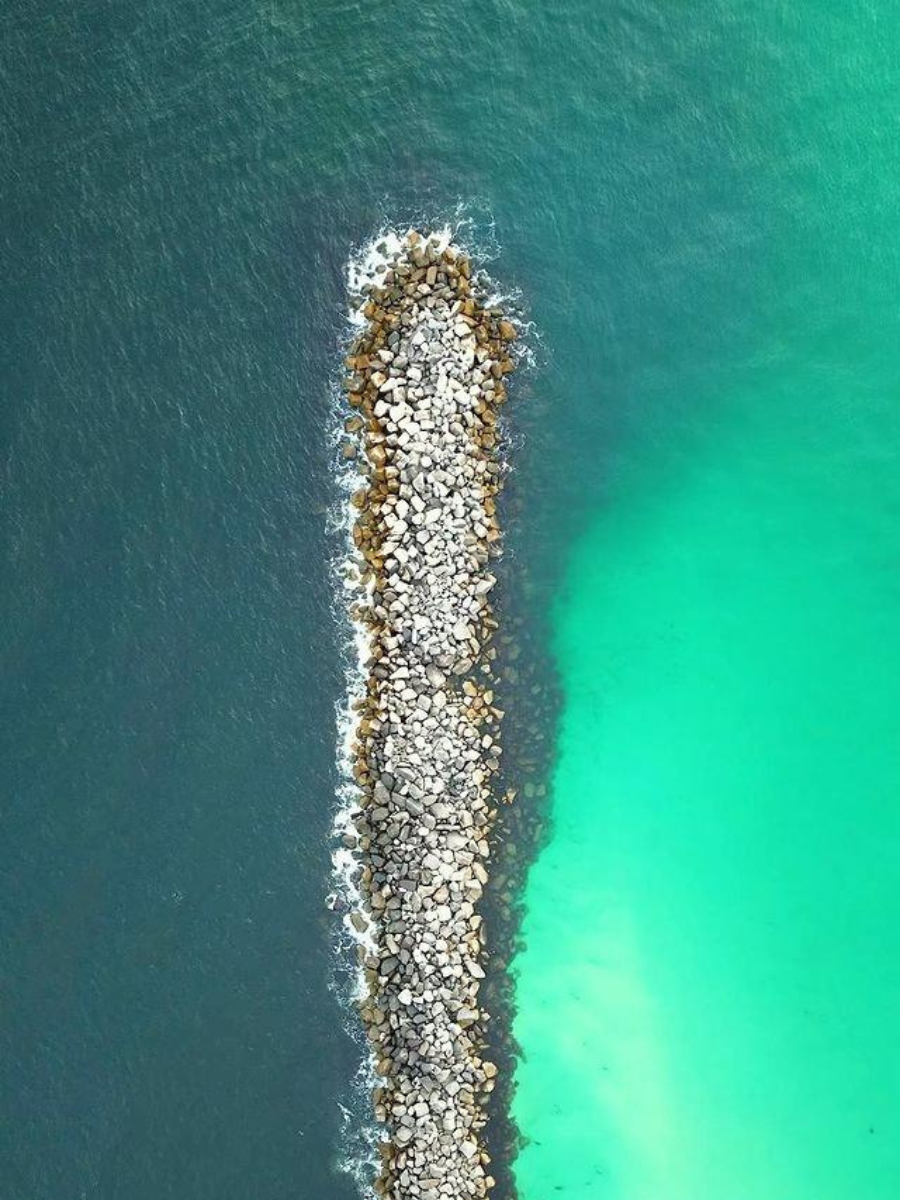 Types of Fishing in Panama City, Florida: Every Way to Get on the Water 10 Aerial view of the St. Andrews State Park jetties, a popular surf fishing spot among the types of fishing in Panama City