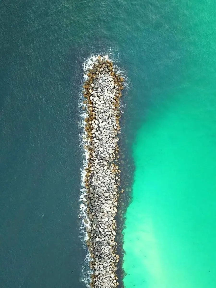 Aerial view of the St. Andrews State Park jetties, a popular surf fishing spot among the types of fishing in Panama City
