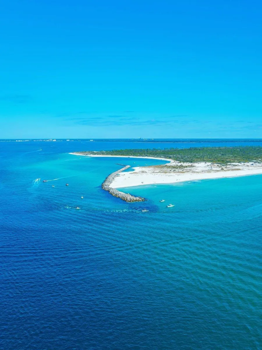 Aerial view of St. Andrews Pass and Shell Island, a top surf fishing destination among the types of fishing in Panama City FL