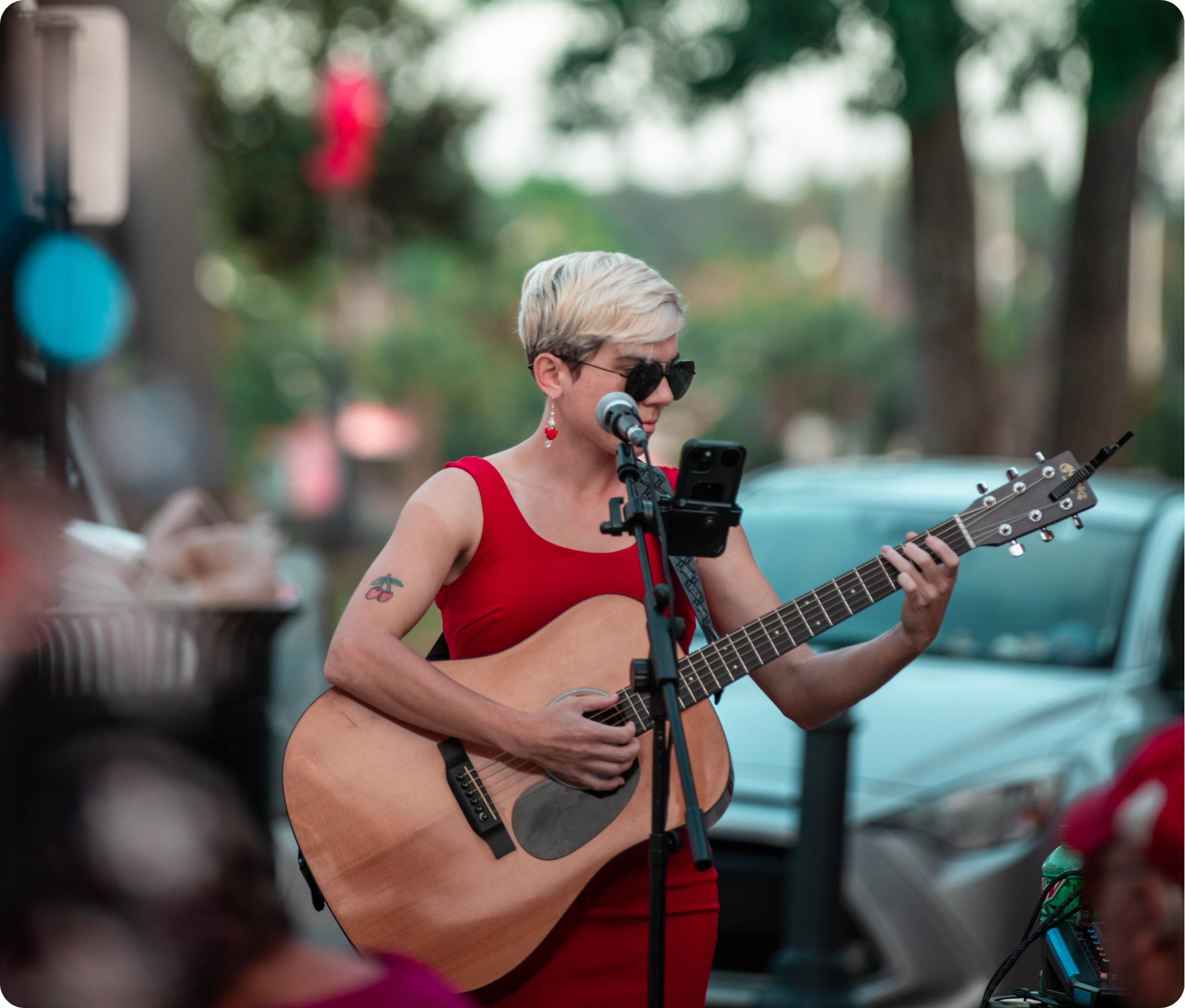 Songwriters Seize the Bay 2 A singer songwriter performs during Songwriters Seize the Bay in Panama City, Florida, playing an acoustic guitar and sharing original music with a live audience in Historic St. Andrews.