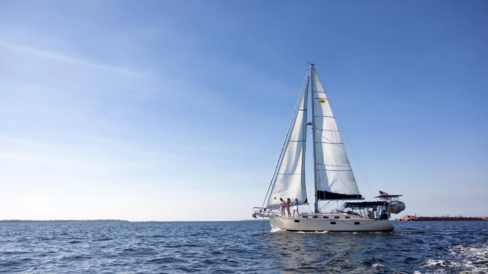 A family on a sailboat in St. Andrews Bay on a day by the bay itinerary in Panama City, Florida