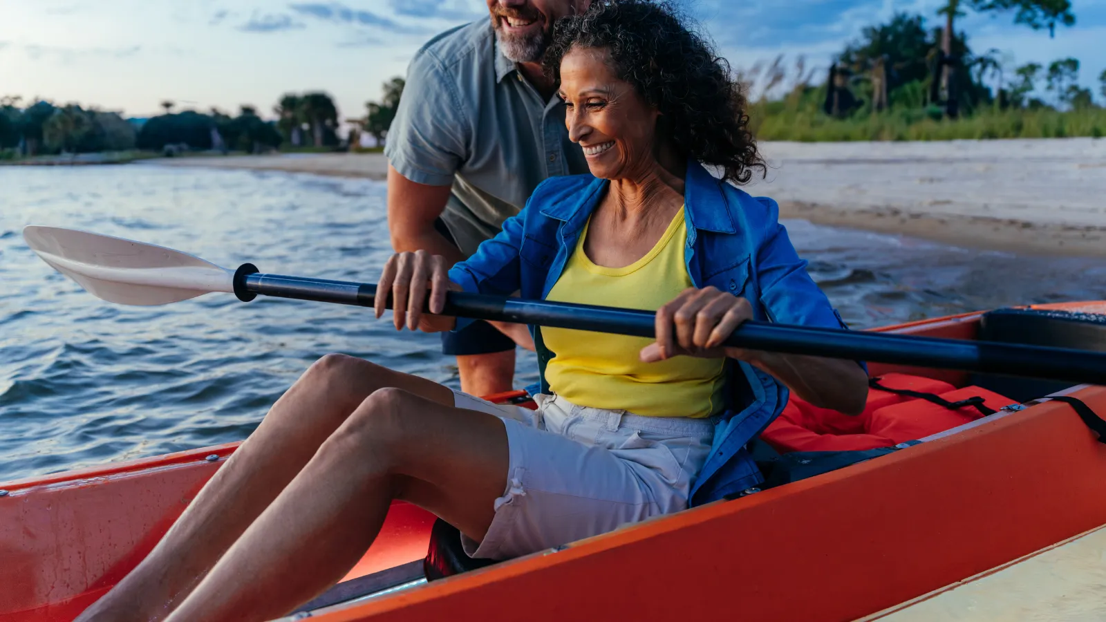 A couple on a glow float kayak during a day by the bay itinerary in Panama City, Florida